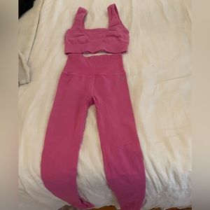 Pink two piece free people movement workout set.